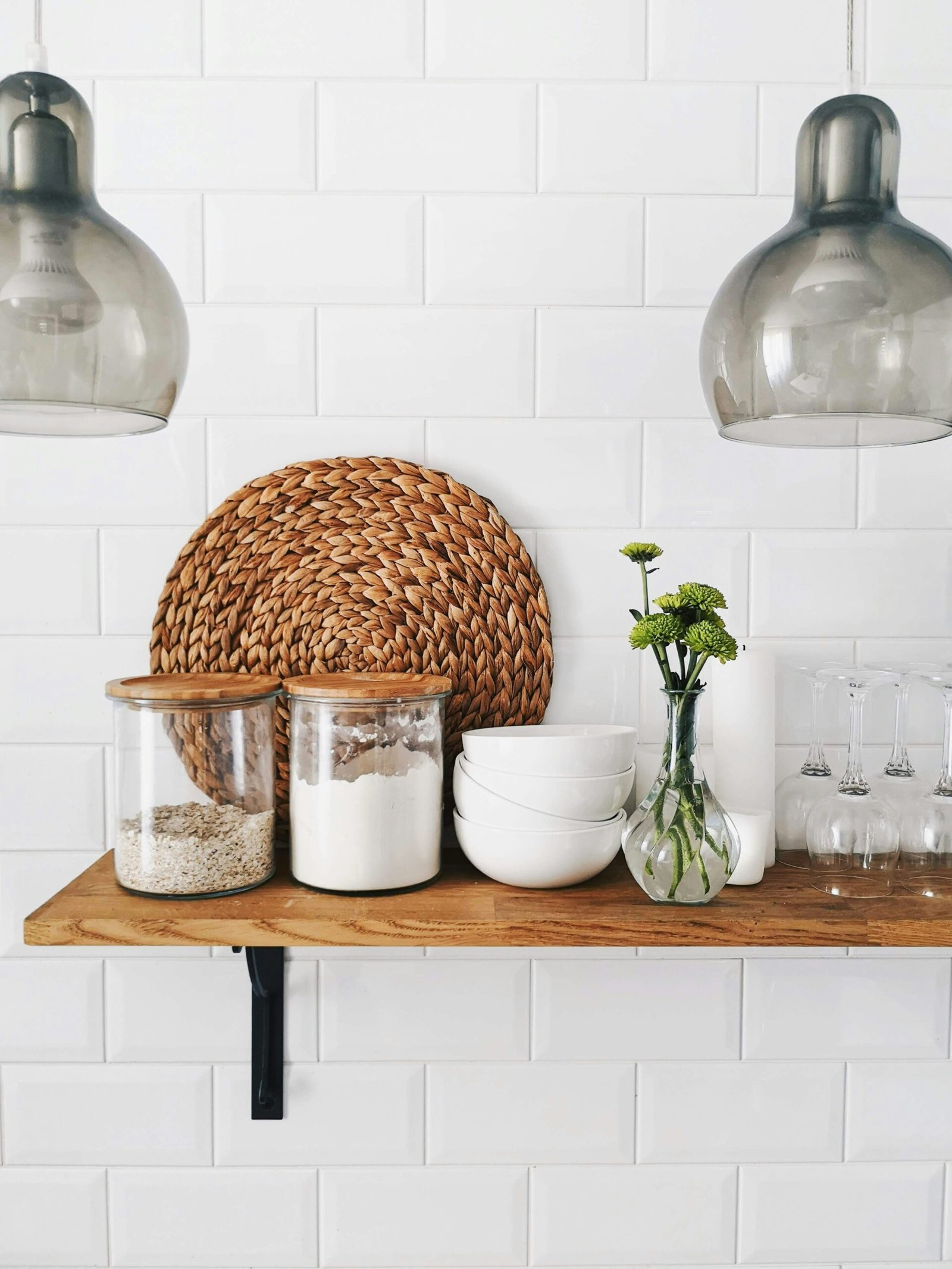 Can organizing your home help reduce stress levels 2 two clear glass jars on brown wooden floating shelf